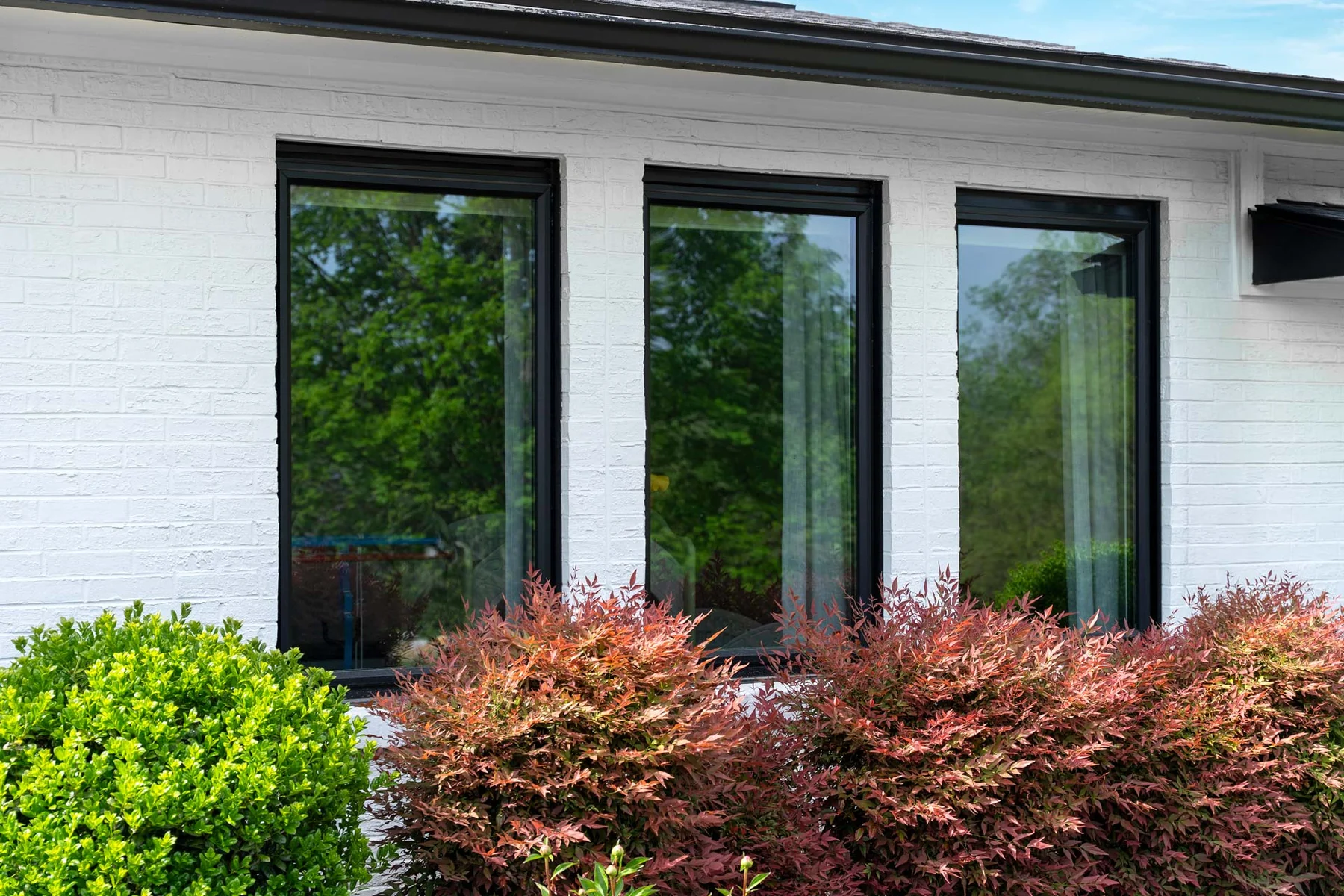 ProVia Endure black picture windows on a home exterior