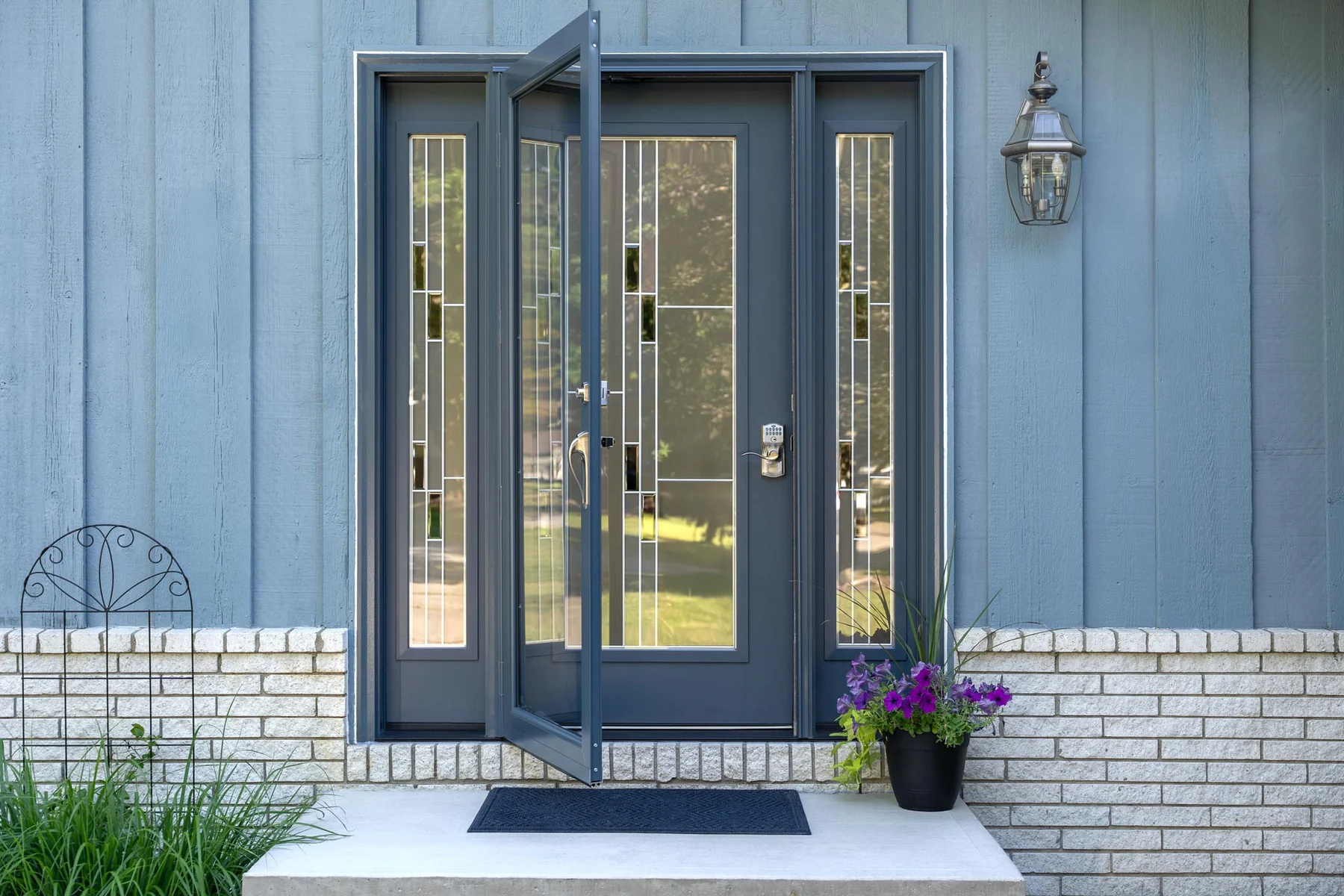 ProVia blue entry door with sidelites and full-view storm door