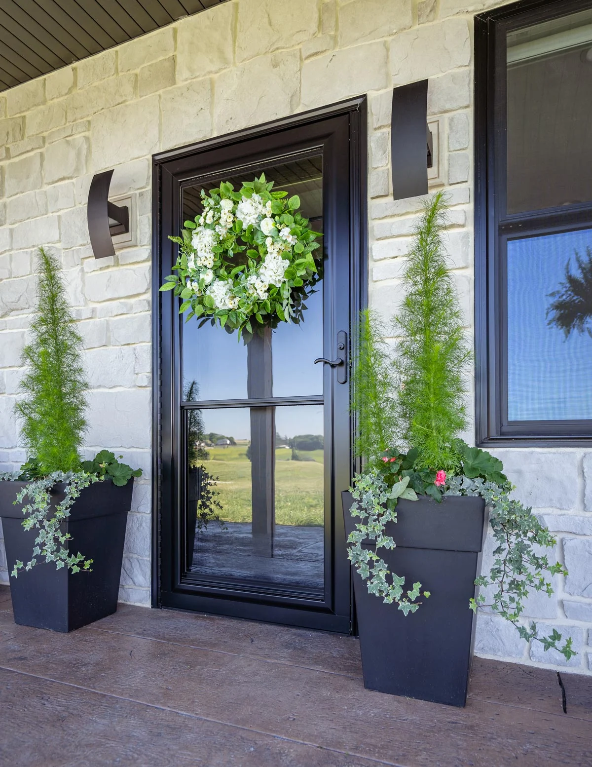 ProVia Spectrum black full-view storm door on a home exterior